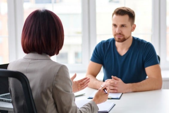 Phoenix car accident attorney explaining common mistakes to a client.